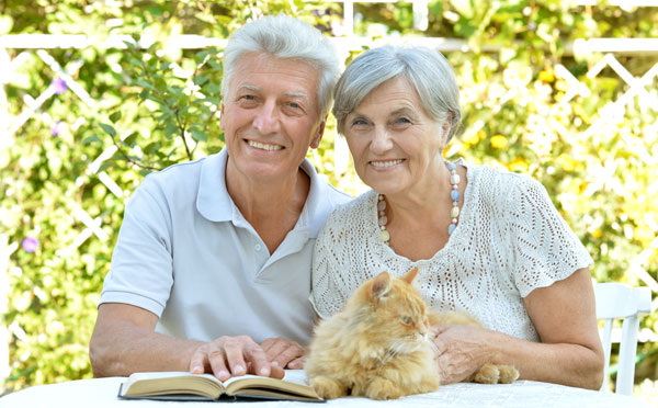 Couple posing with cat
